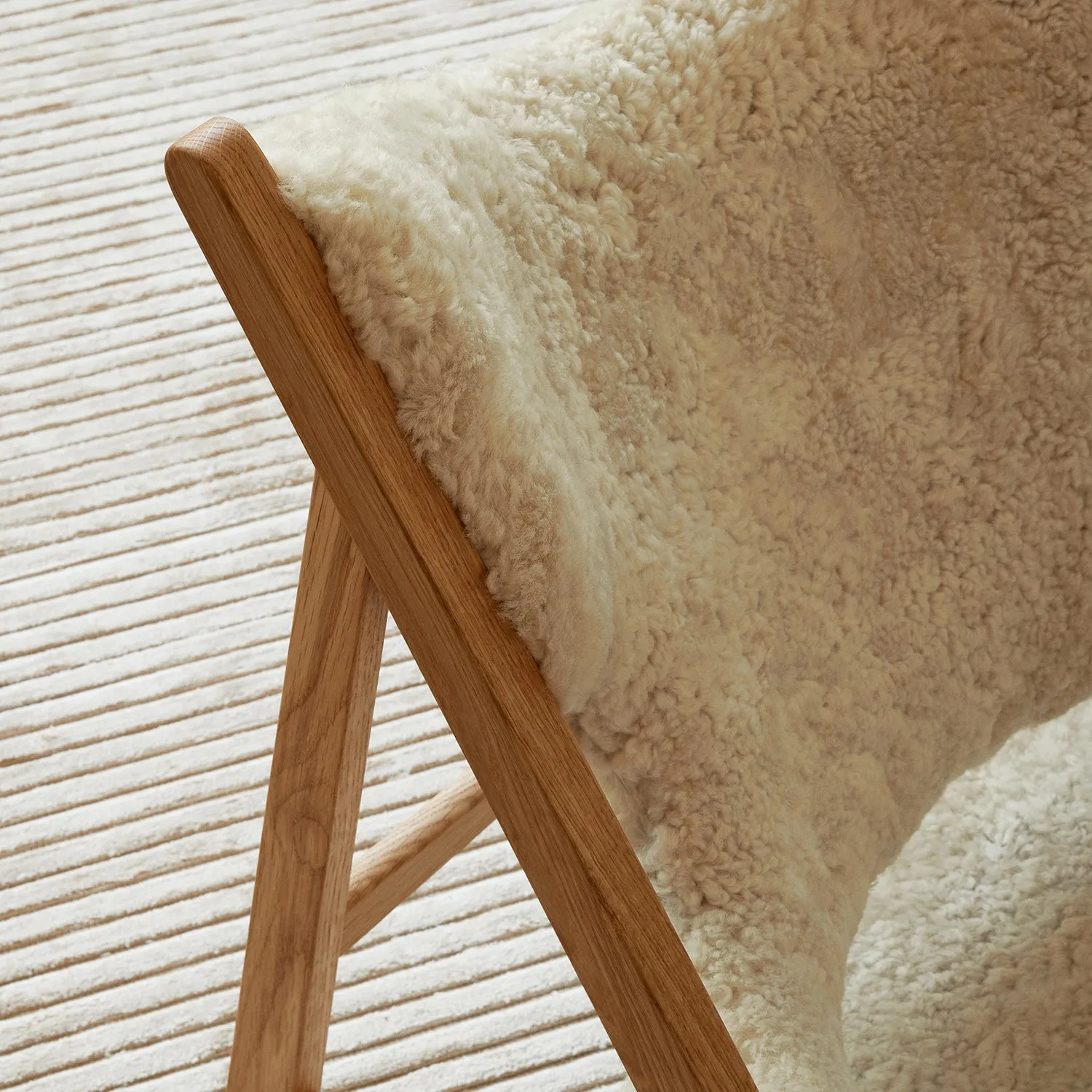 audo copenhagen (menu) | knitting lounge chair | sheepskin nature   natural oak base