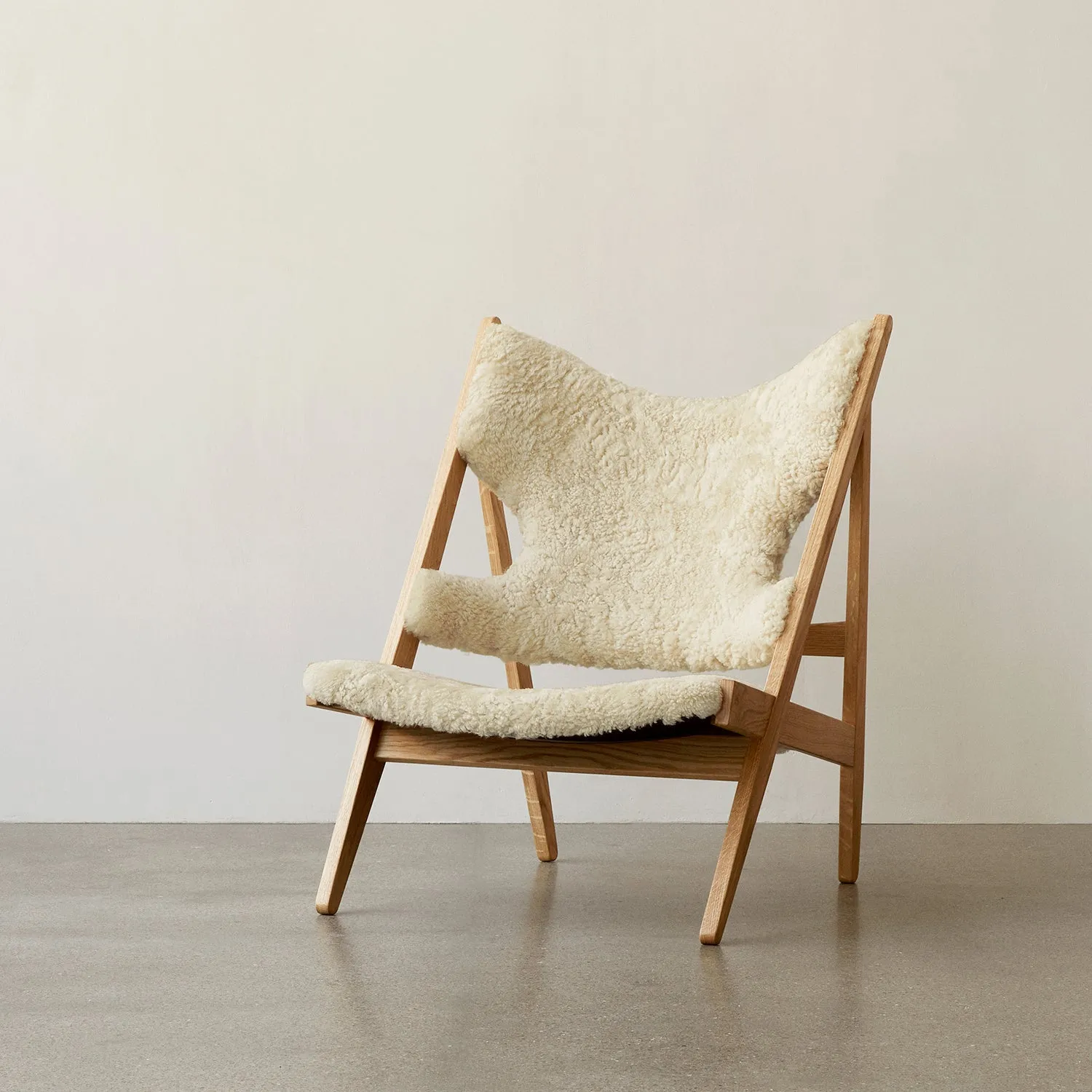 audo copenhagen (menu) | knitting lounge chair | sheepskin nature   natural oak base